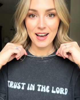 Customer wearing faith-inspired jewelry